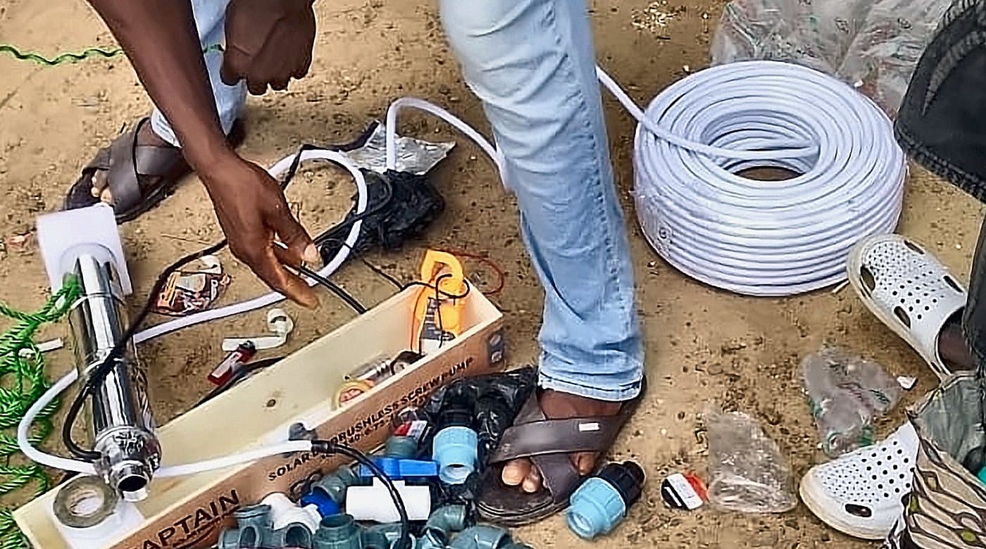 Solar pump, DC controller, fittings and cable laid out on site before installation